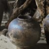 Rustic clay pot with rough texture