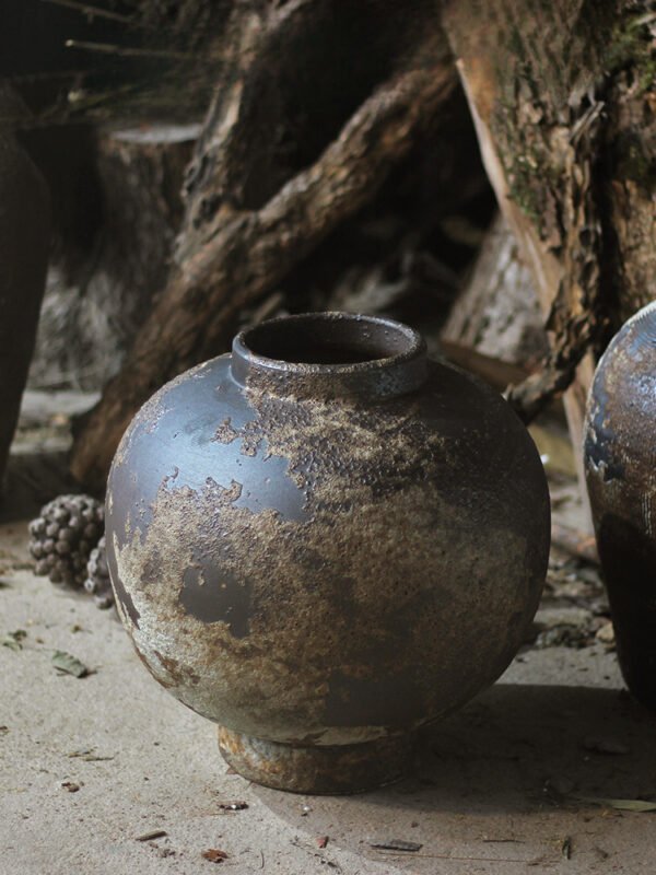 Rustic clay pot with rough texture