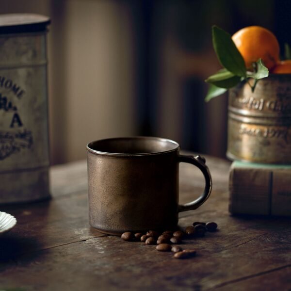 Rustic mug with coffee beans on wooden table