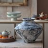 Rustic ceramic vase on wooden table