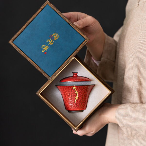 Red tea cup in decorative box