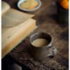 Tea with open book on rustic table